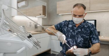 dentist checking on a patient s teeth