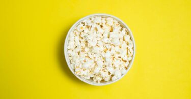 popcorn serving in white ceramic bowl