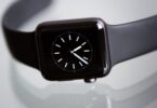 black apple watch with black sports band