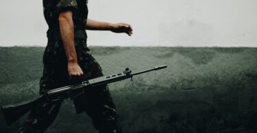 soldier holding gun