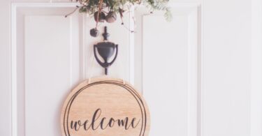 brown wooden welcome wall decor