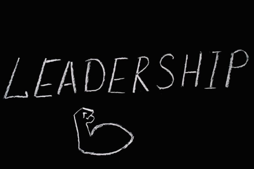 leadership lettering text on black background