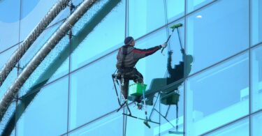 photo of a man cleaning windows