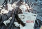 beer bottle and statement bills